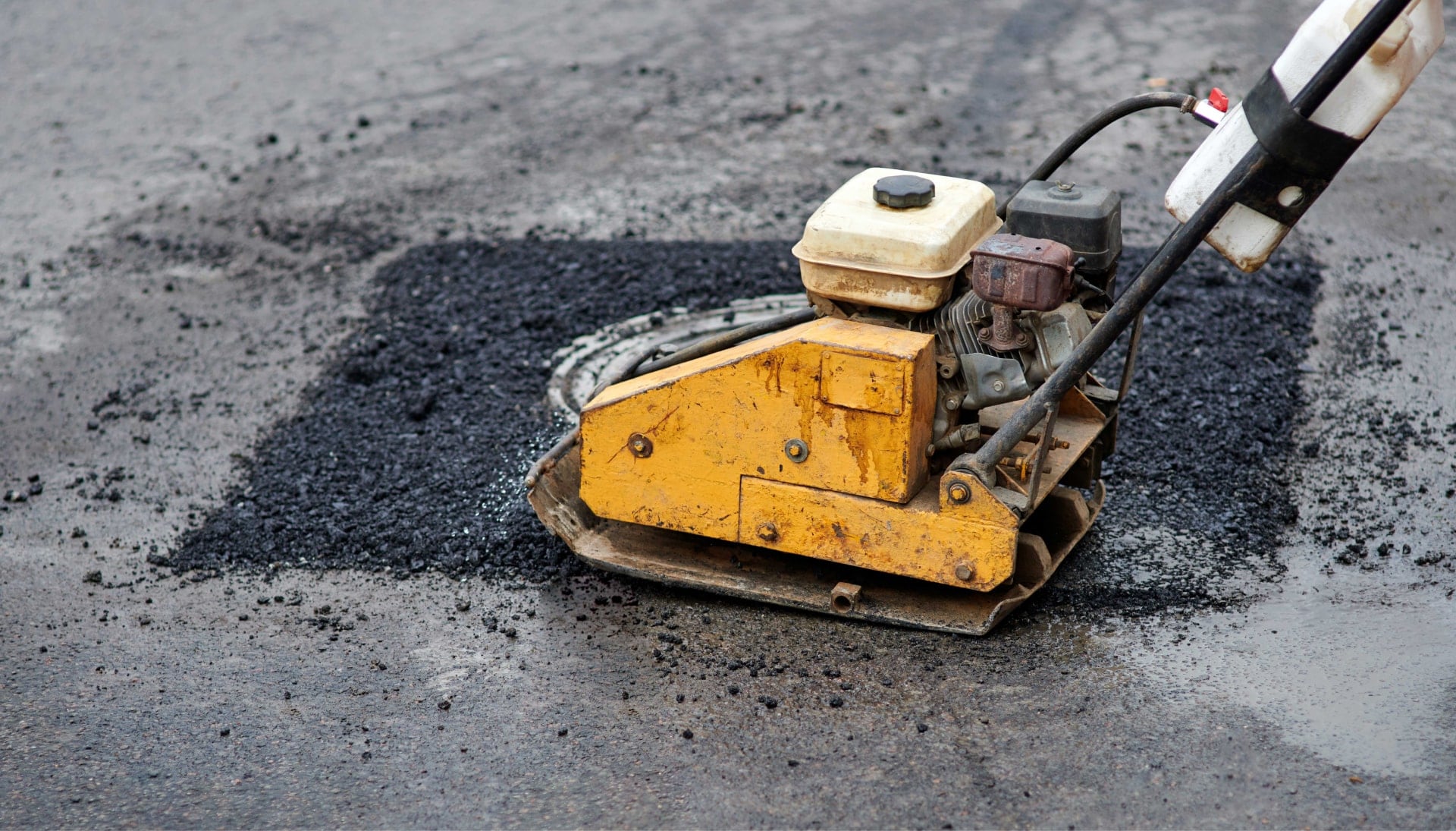 Commercial grade equipment is used to perform necessary asphalt repair in Akron, OH.