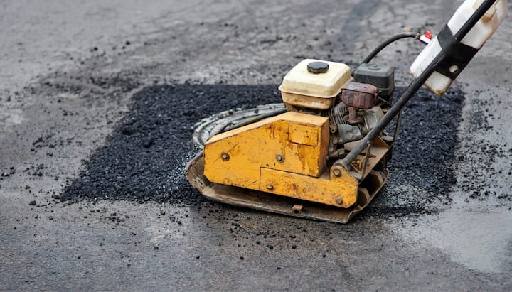 Commercial grade equipment is used to perform necessary asphalt repair in Akron, OH.